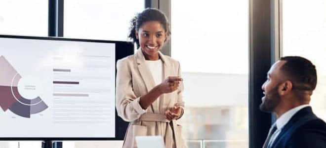 woman giving a presentation in a conference room