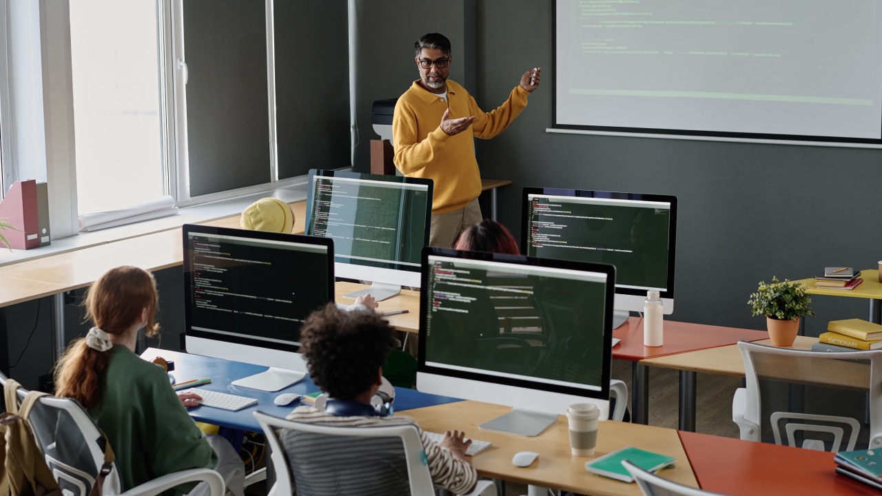 professor teaching to students in a classroom